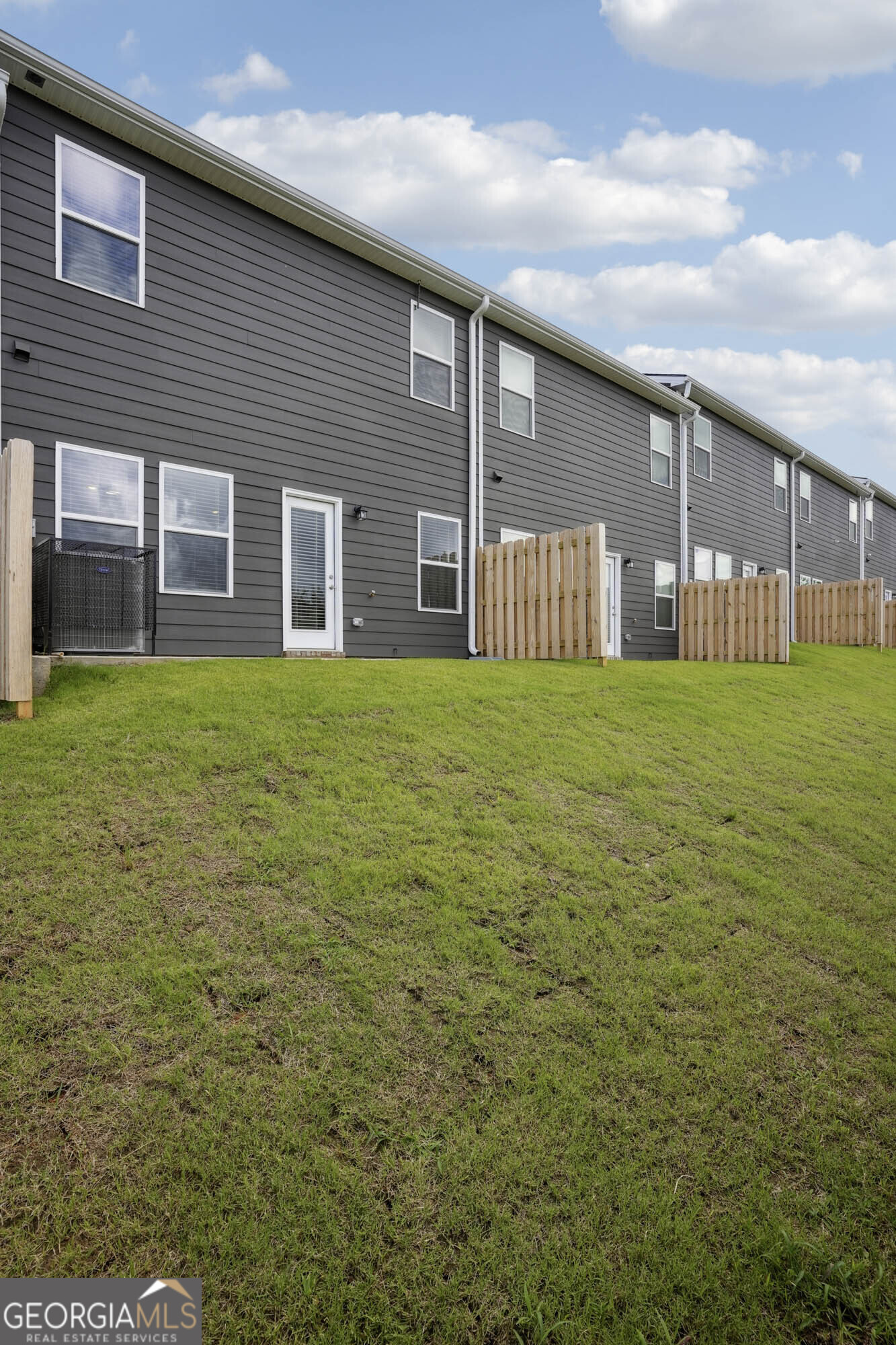 11518 Kimberly Way Hampton, GA 30228 - Photo 3 of 3 a view of a yard in front of a house