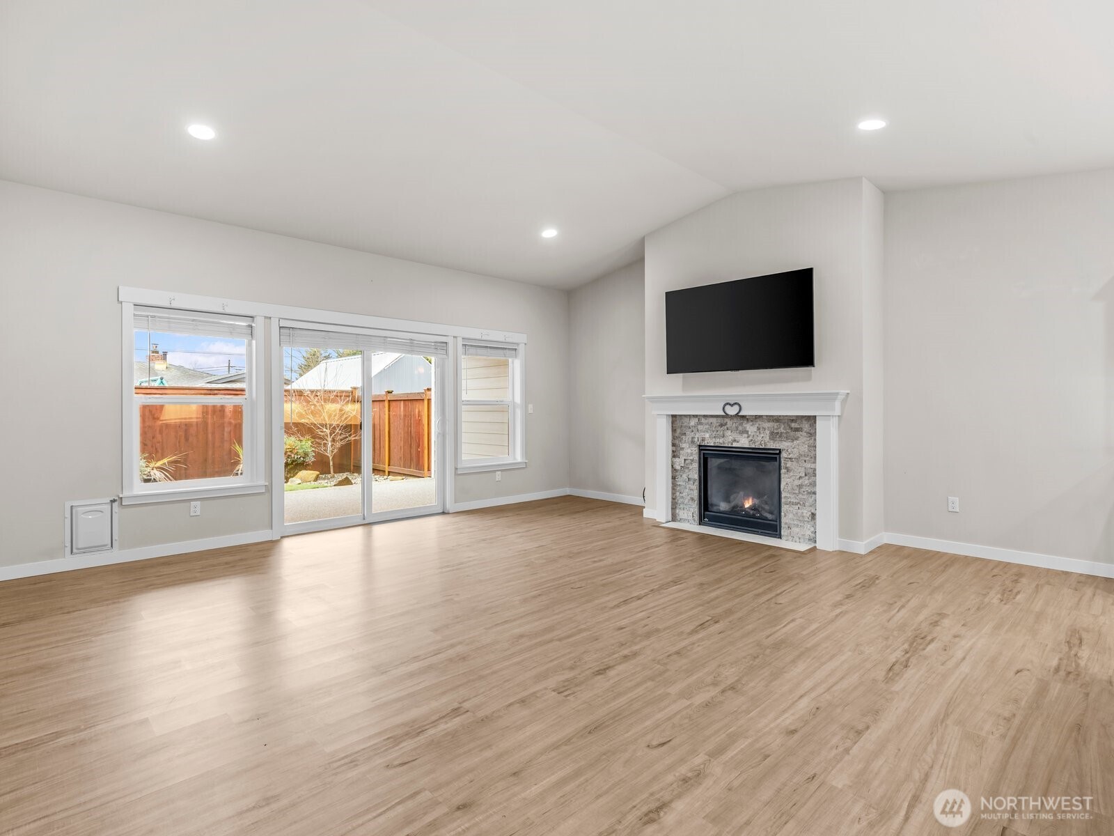 742 Parkland Loop Sedro-Woolley, WA 98284 - Photo 14 of 33 a view of an empty room with a fireplace and a window