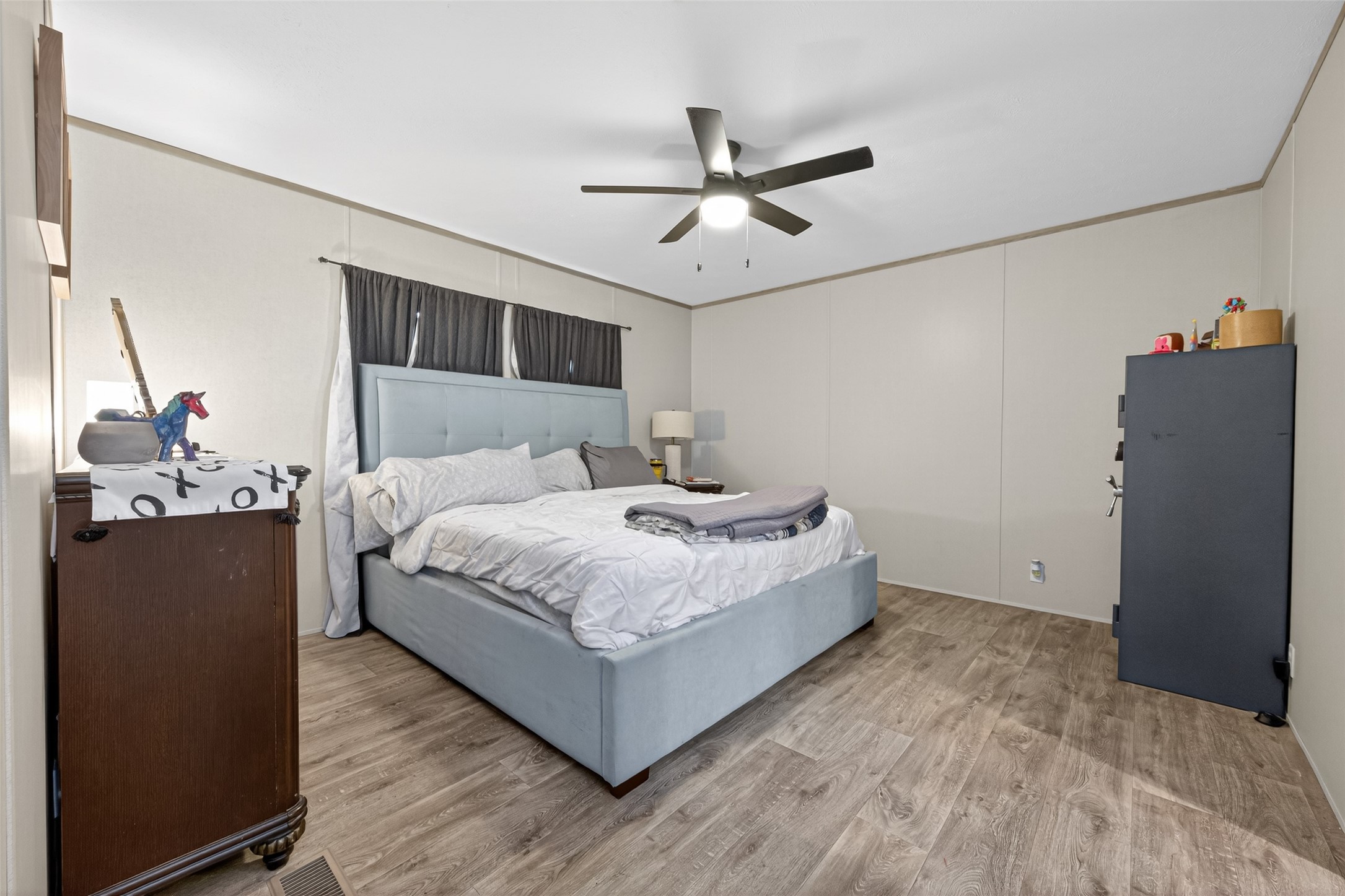 1375 Road 5735 Cleveland, TX 77327 - Photo 18 of 49 a bedroom with a bed and dresser