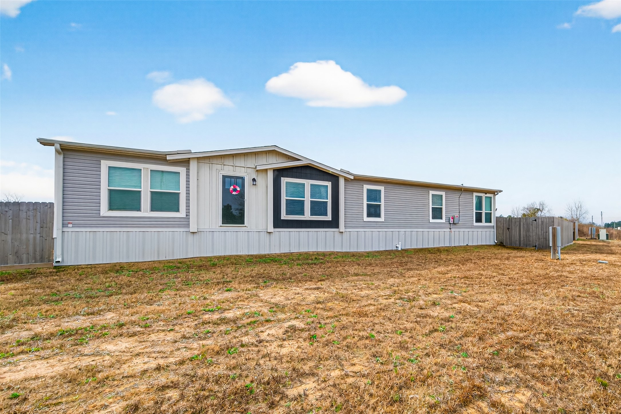 1375 Road 5735 Cleveland, TX 77327 - Photo 2 of 49 a view of an house with backyard space and balcony
