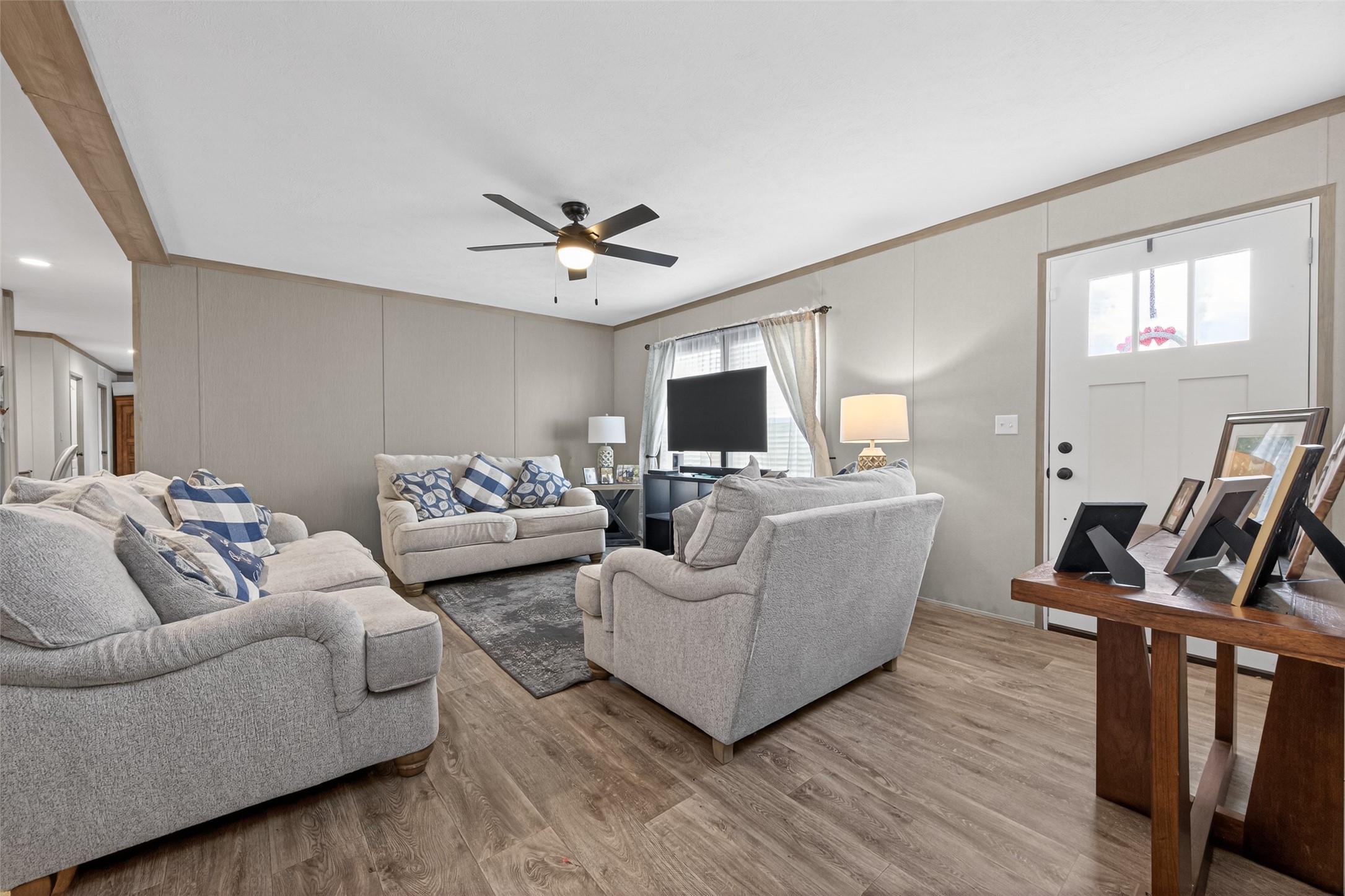 1375 Road 5735 Cleveland, TX 77327 - Photo 6 of 49 a living room with furniture flat screen tv and wooden floor