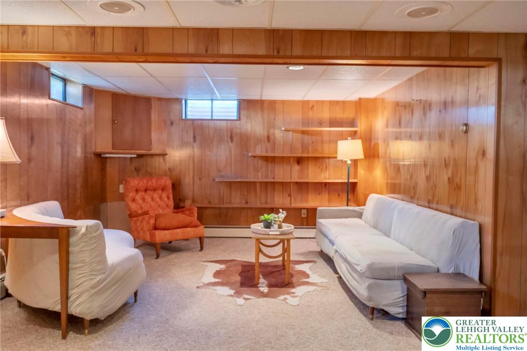 13 Ridgewood Road Easton, PA 18045 - Photo 27 of 32 A relaxed lower-level retreat with built-in shelving, ready for cozy gatherings.