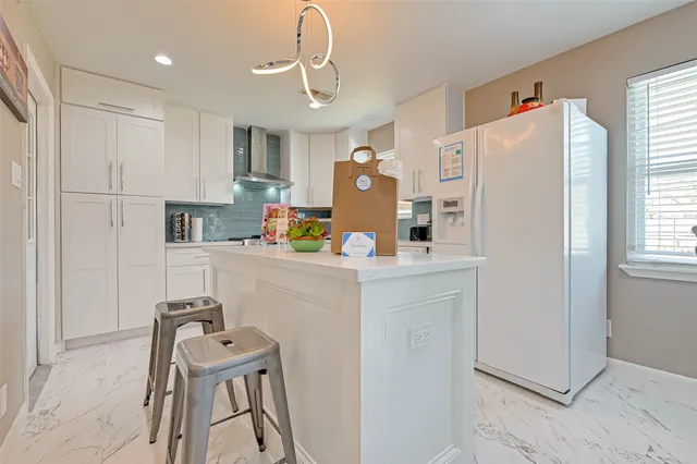 a utility room with a window dryer and washer