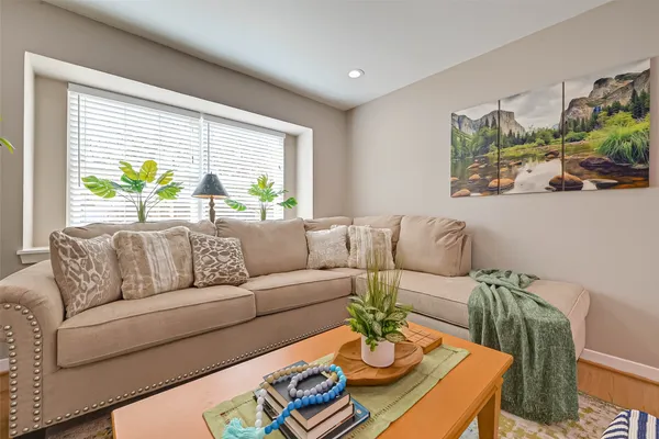 a living room with furniture and window