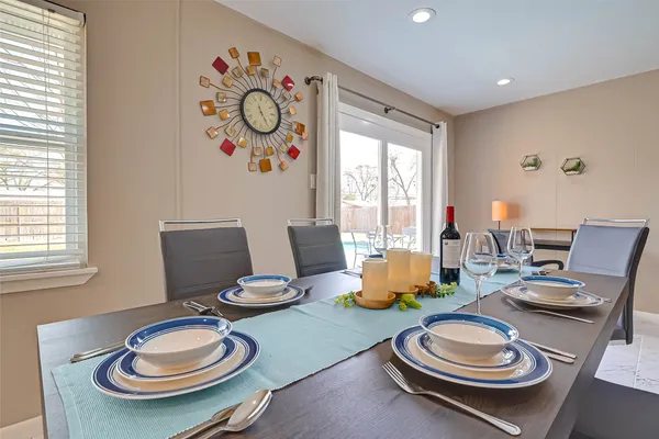 a kitchen with white cabinets and appliances