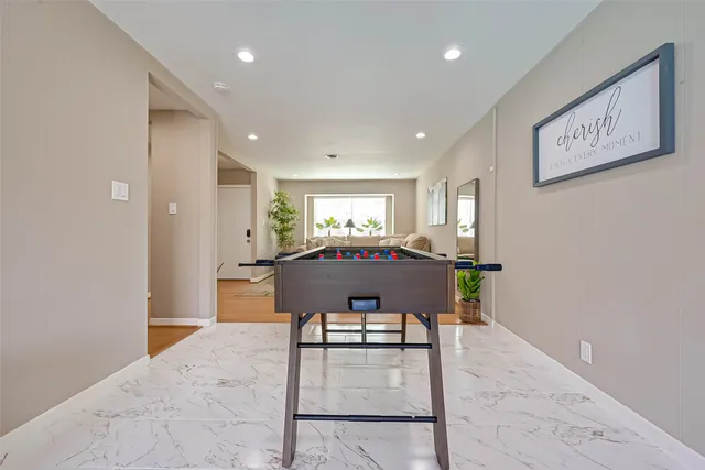 a kitchen with stainless steel appliances a refrigerator sink and cabinets