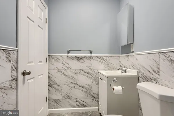a bathroom with a shower and mirror