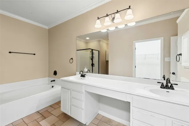 a bathroom with a toilet a sink a mirror a bathtub and vanity