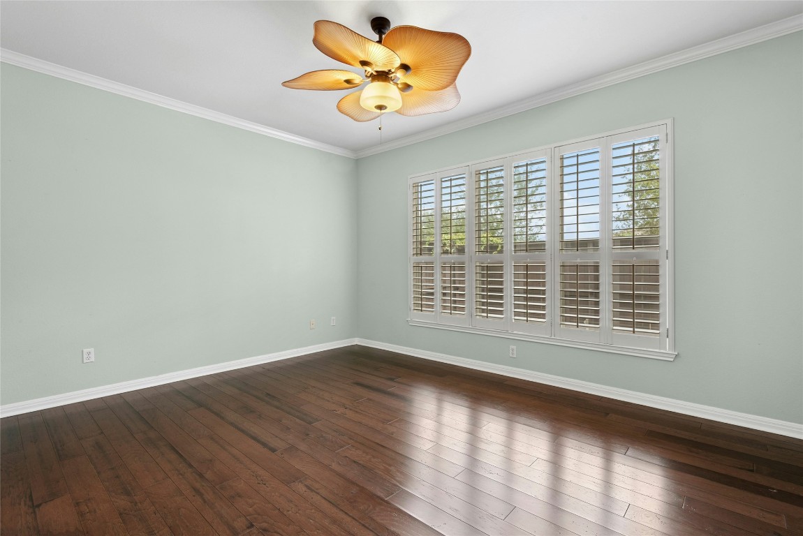 7500 Shadowridge Run, Unit 34 Austin, TX 78749 - Photo 16 of 39 a view of empty room with wooden floor and fan