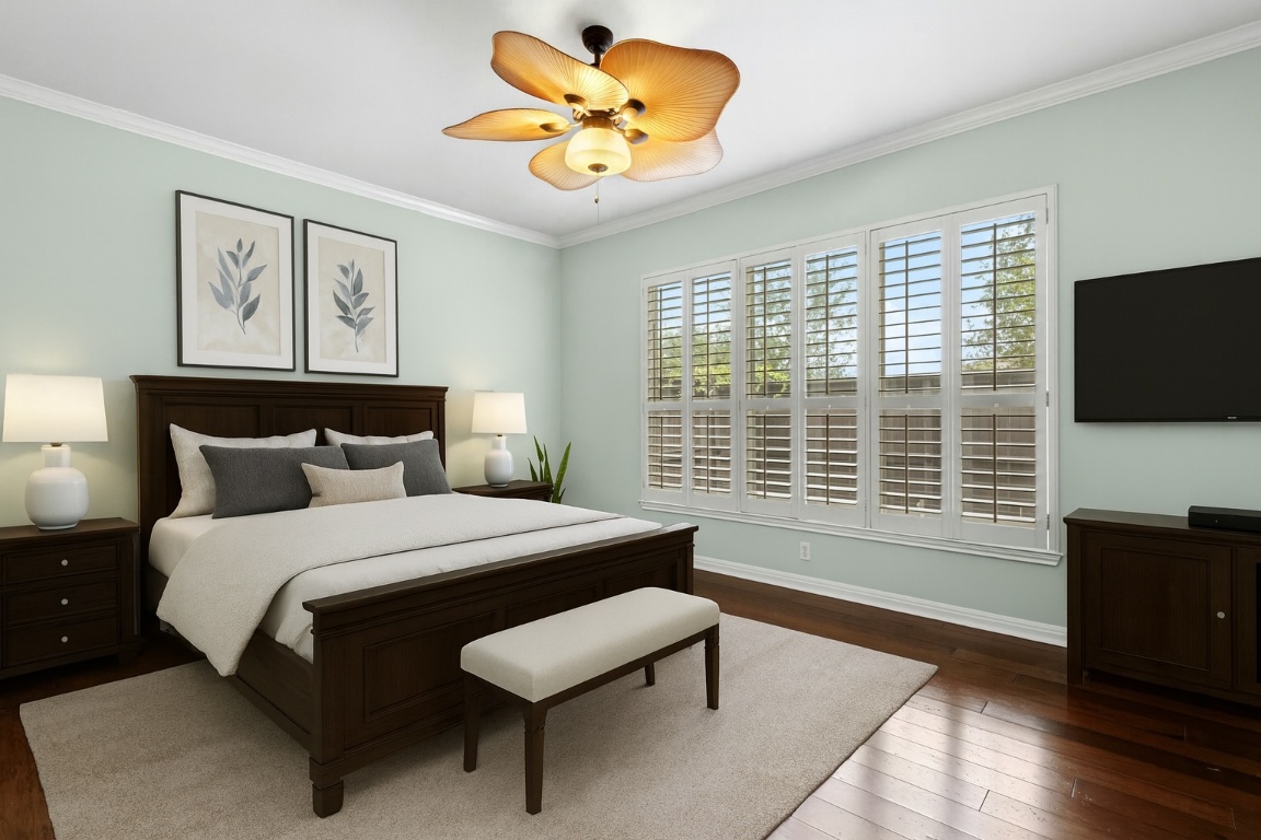 7500 Shadowridge Run, Unit 34 Austin, TX 78749 - Photo 17 of 39 a spacious bedroom with a bed and a flat screen tv