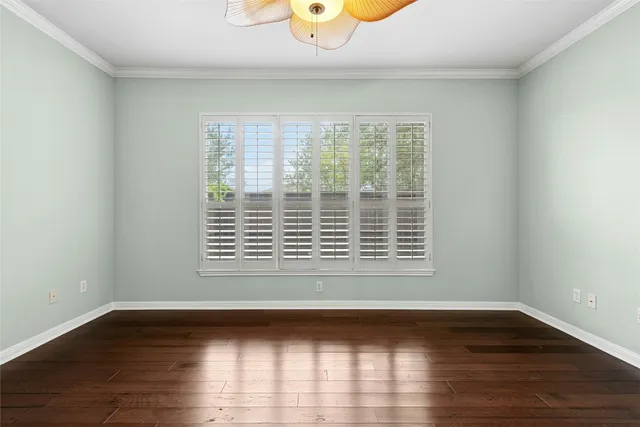 a view of an empty room and wooden floor