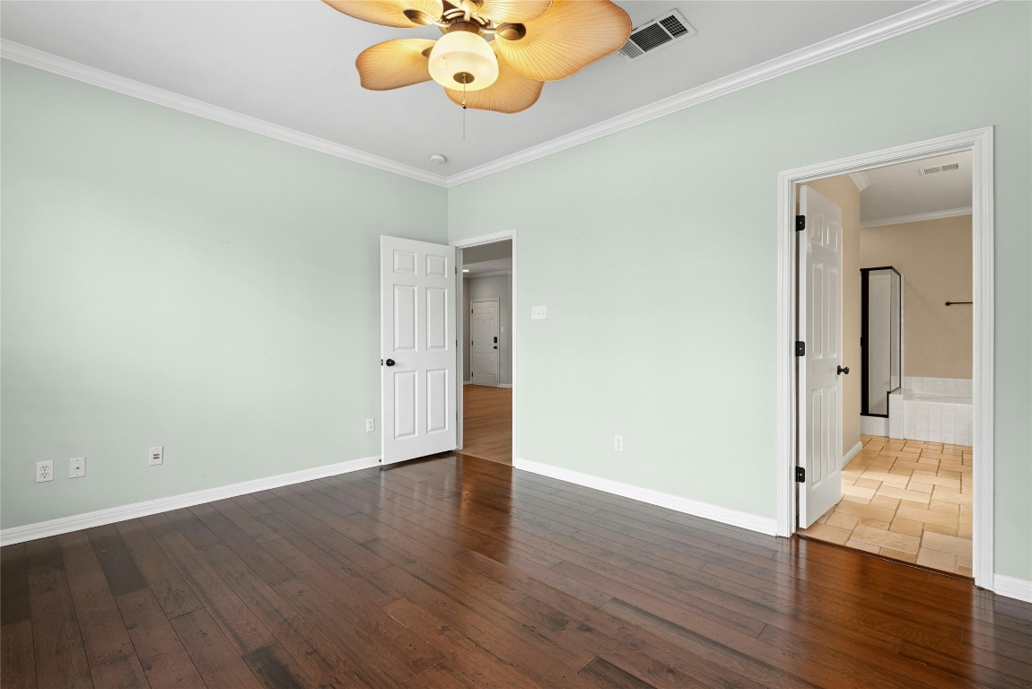 7500 Shadowridge Run, Unit 34 Austin, TX 78749 - Photo 19 of 39 a view of an empty room and wooden floor