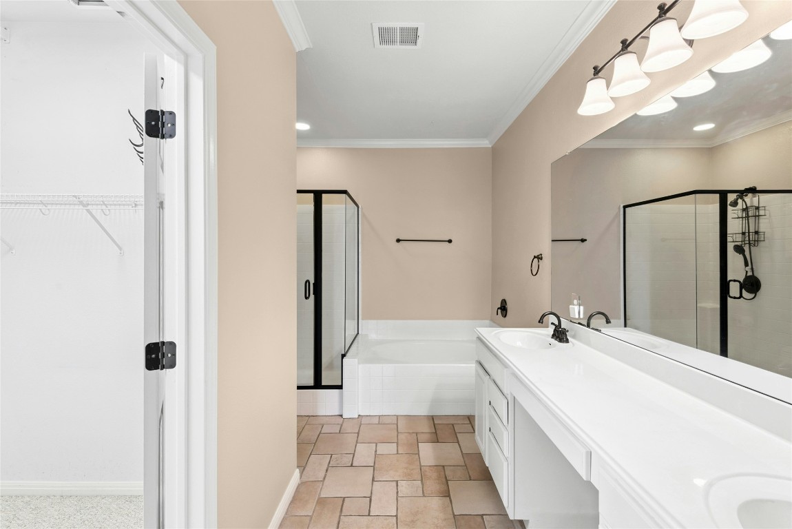 7500 Shadowridge Run, Unit 34 Austin, TX 78749 - Photo 20 of 39 a bathroom with a tub sink and mirror