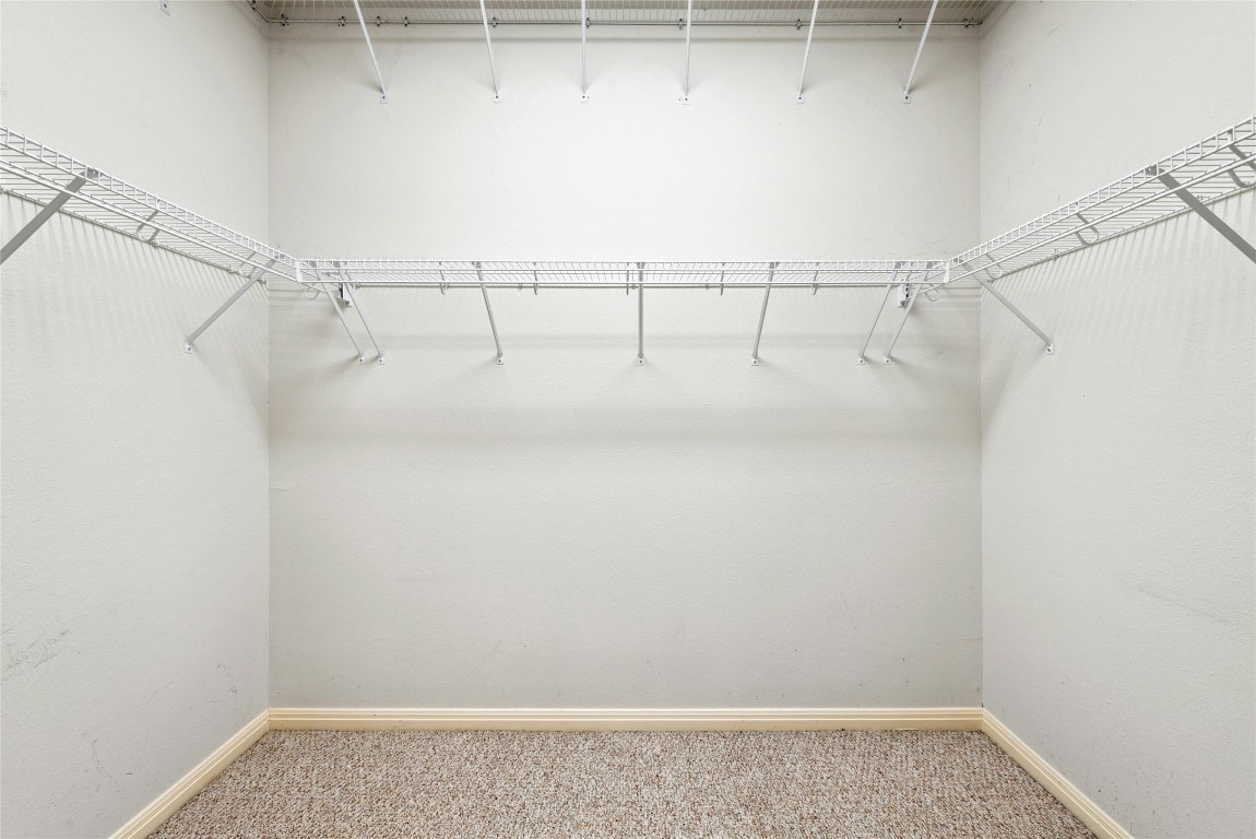 7500 Shadowridge Run, Unit 34 Austin, TX 78749 - Photo 23 of 39 a view of a room with racks on the wall