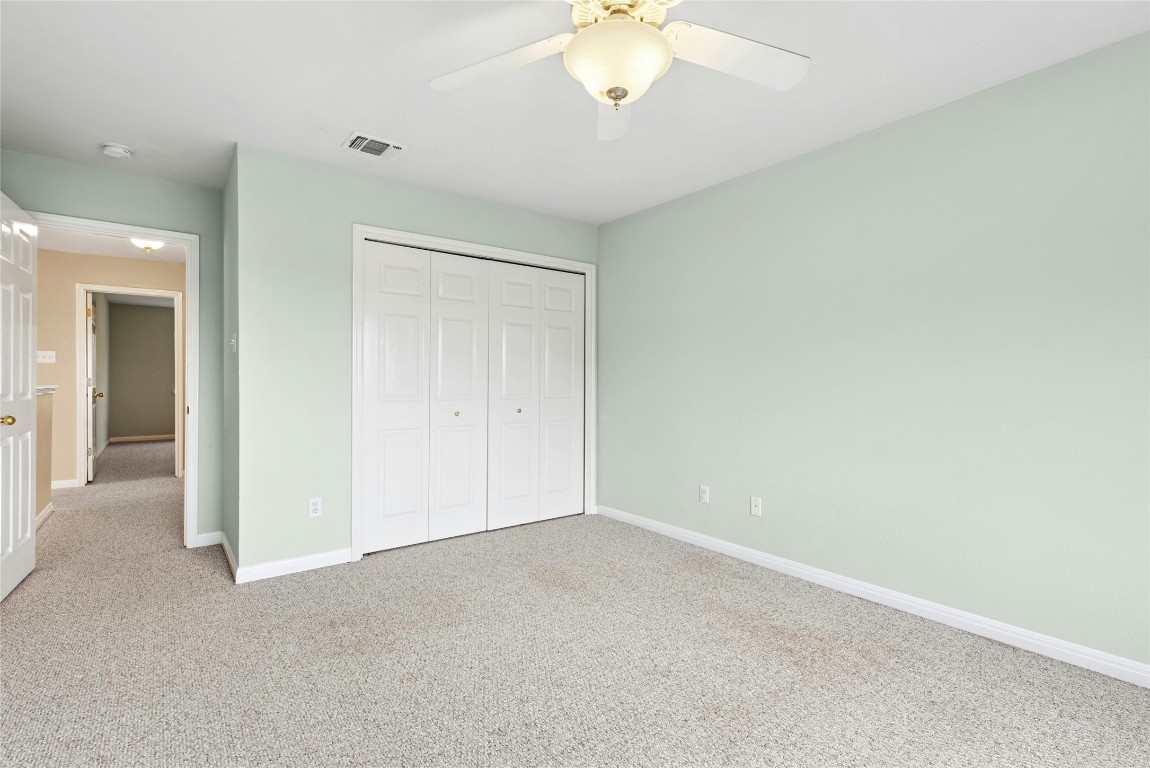 7500 Shadowridge Run, Unit 34 Austin, TX 78749 - Photo 36 of 39 an empty room with a chandelier fan