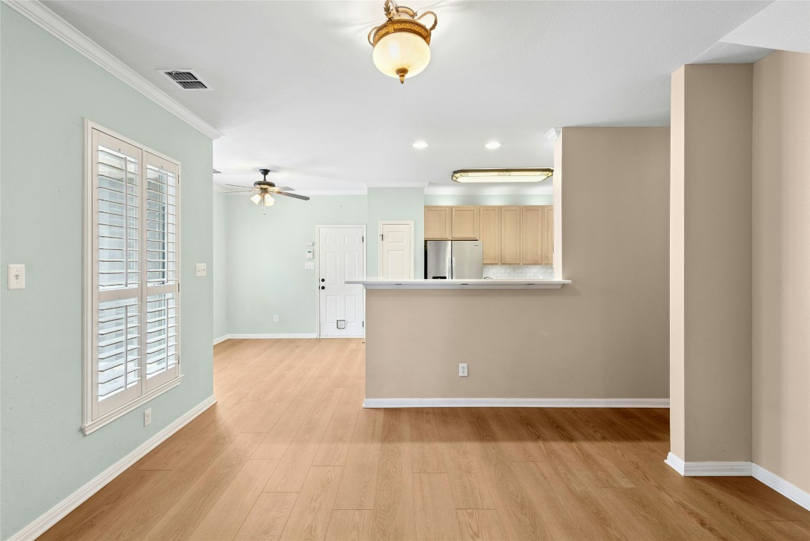 7500 Shadowridge Run, Unit 34 Austin, TX 78749 - Photo 6 of 39 a view of kitchen with wooden floor and window