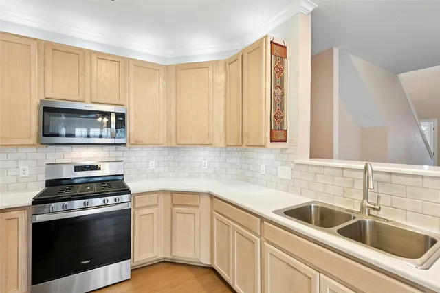 a kitchen with a refrigerator stove and microwave