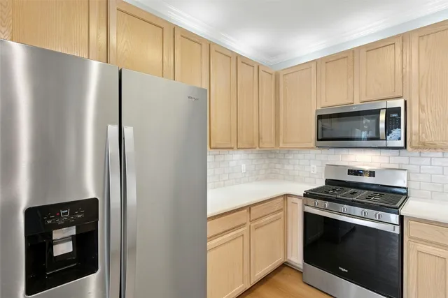 a kitchen with a sink and a refrigerator