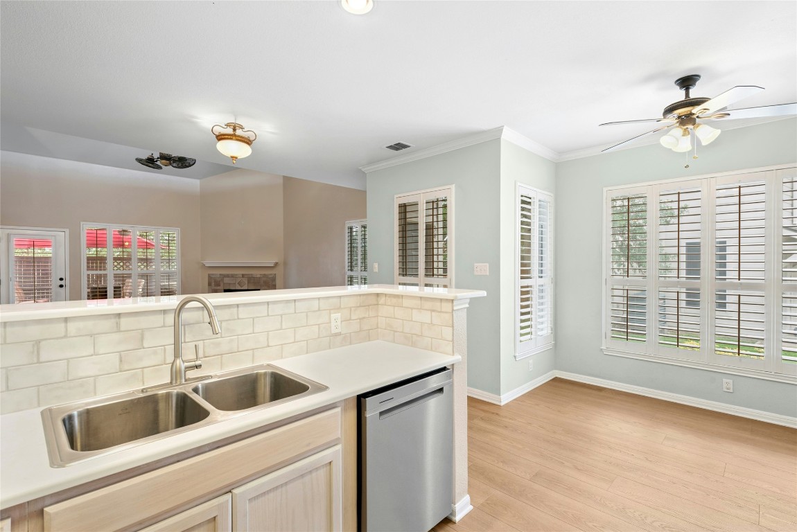 7500 Shadowridge Run, Unit 34 Austin, TX 78749 - Photo 10 of 39 a kitchen with a sink and a refrigerator