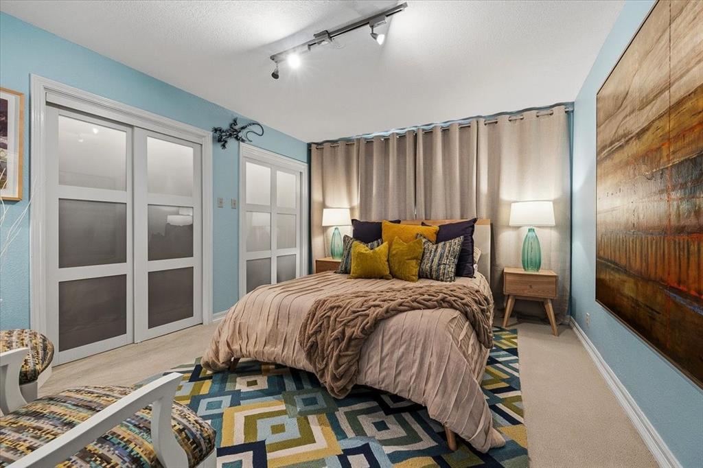 308 North Broadway Road Azle, TX 76020 - Photo 23 of 31 a bedroom with a bed and a large window