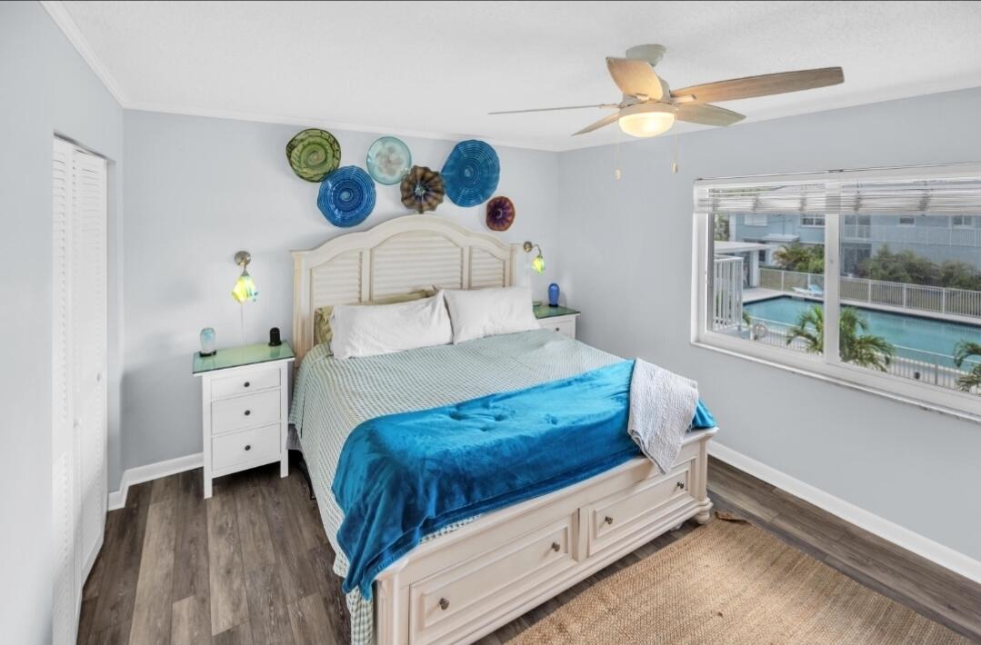 40 High Point Road, Unit C105 Tavernier, FL 33070 - Photo 3 of 8 a bedroom with a bed and a window