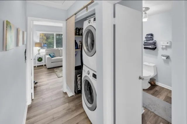 a view of a hallway with washer and dryer