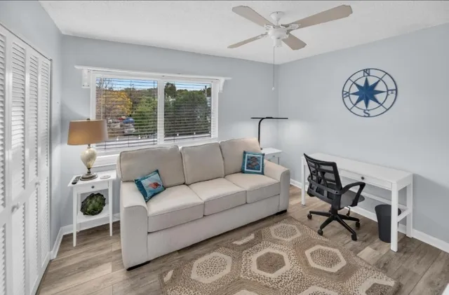 a living room with furniture and a window