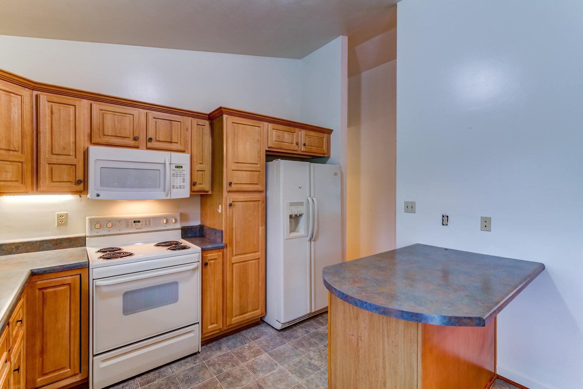 1632 Meadows Road Vinton, VA 24179 - Photo 13 of 47 a kitchen with a stove a sink and a refrigerator