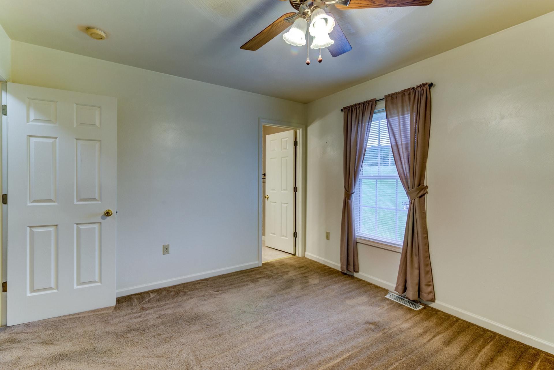 1632 Meadows Road Vinton, VA 24179 - Photo 22 of 47 wooden floor in an empty room with a window