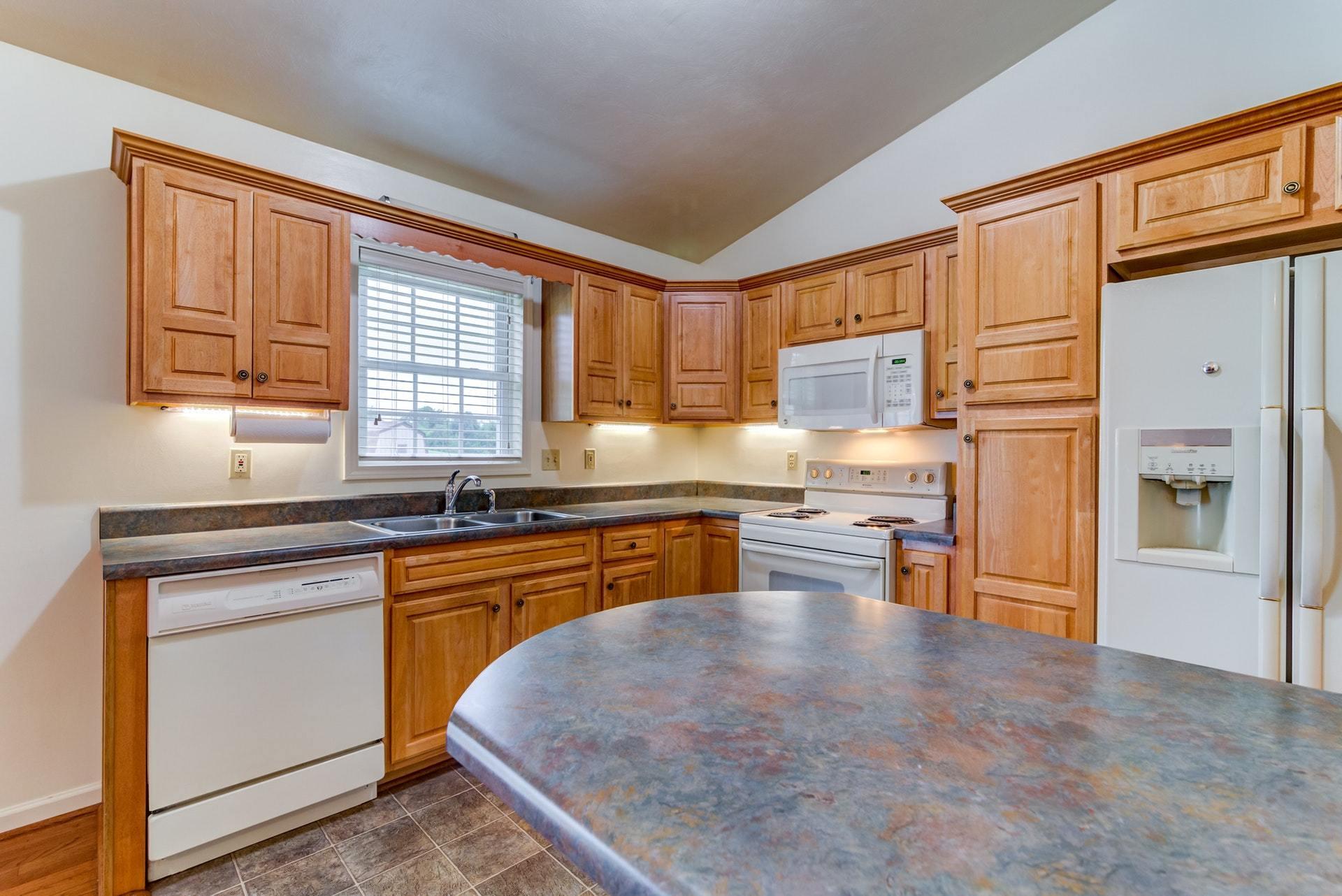 1632 Meadows Road Vinton, VA 24179 - Photo 10 of 47 a kitchen with stainless steel appliances granite countertop a stove a sink dishwasher and a refrigerator