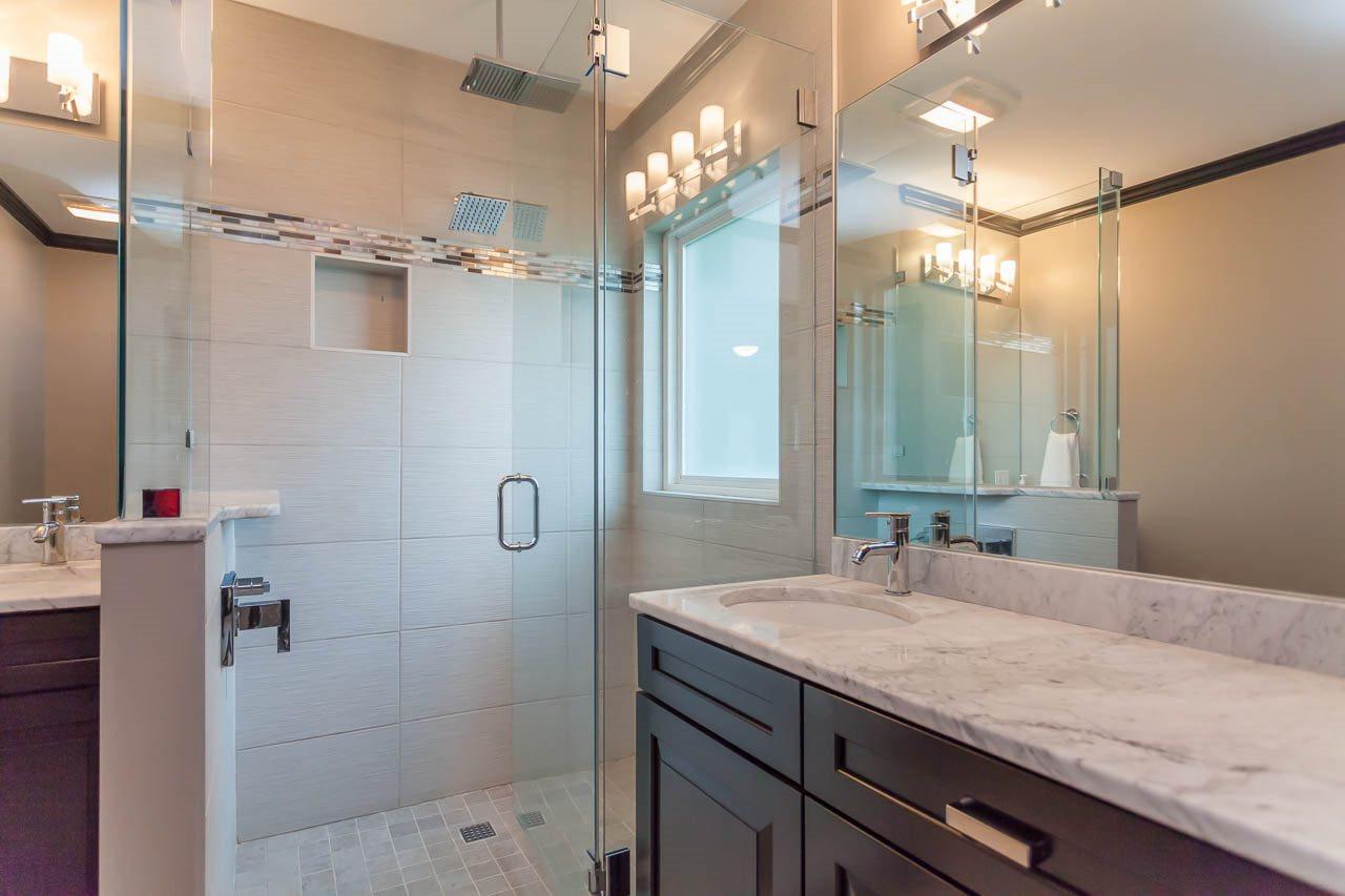 3145 Merrianne Drive Raleigh, NC 27607 - Photo 16 of 25 The spa-like master bath offers 2 vanities with marble counter tops and distinctive tile flooring. New Master Bath
