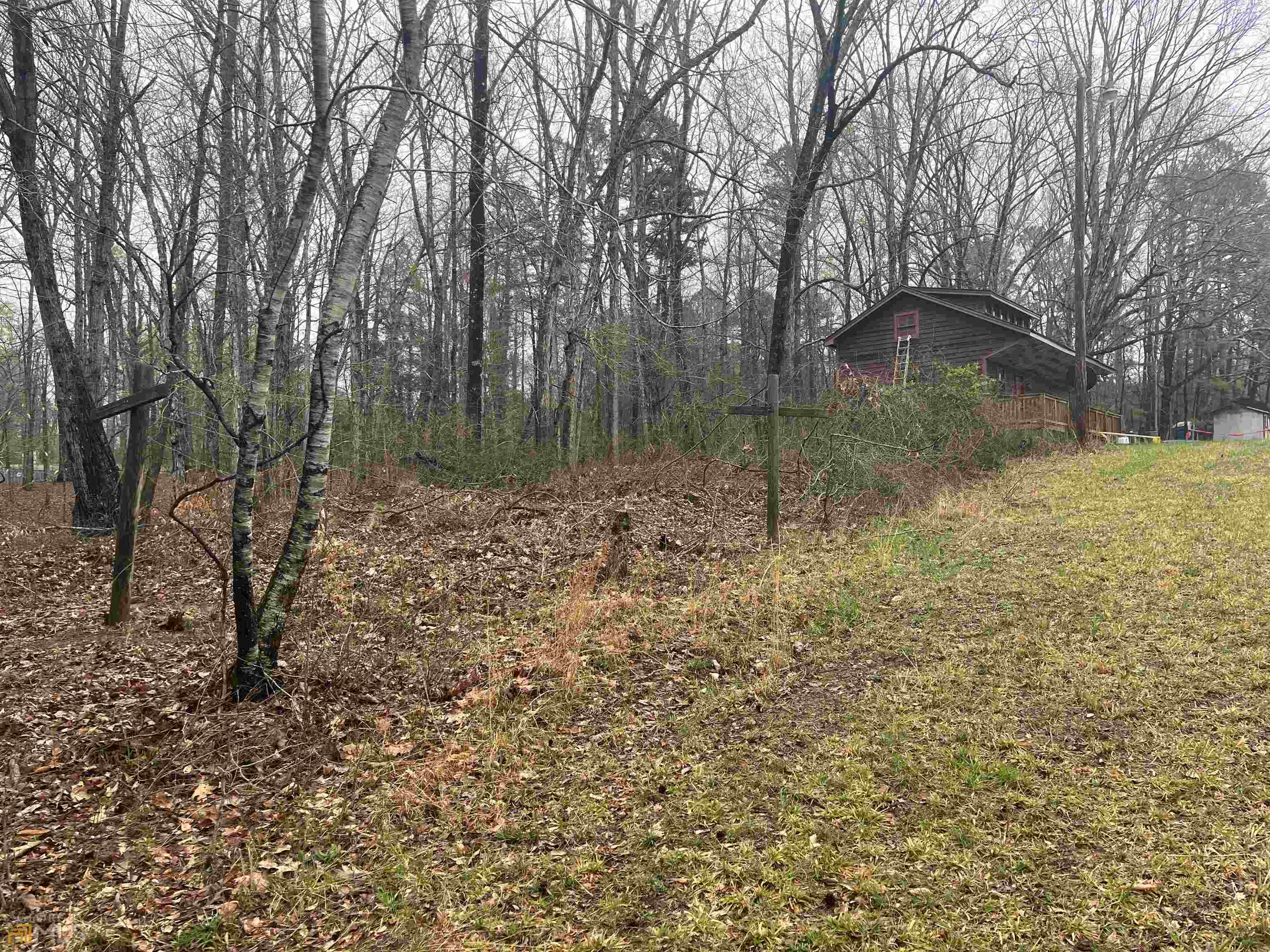 3720 McEver Road Oakwood, GA 30566 - Photo 17 of 73 a backyard of a house with lots of green space