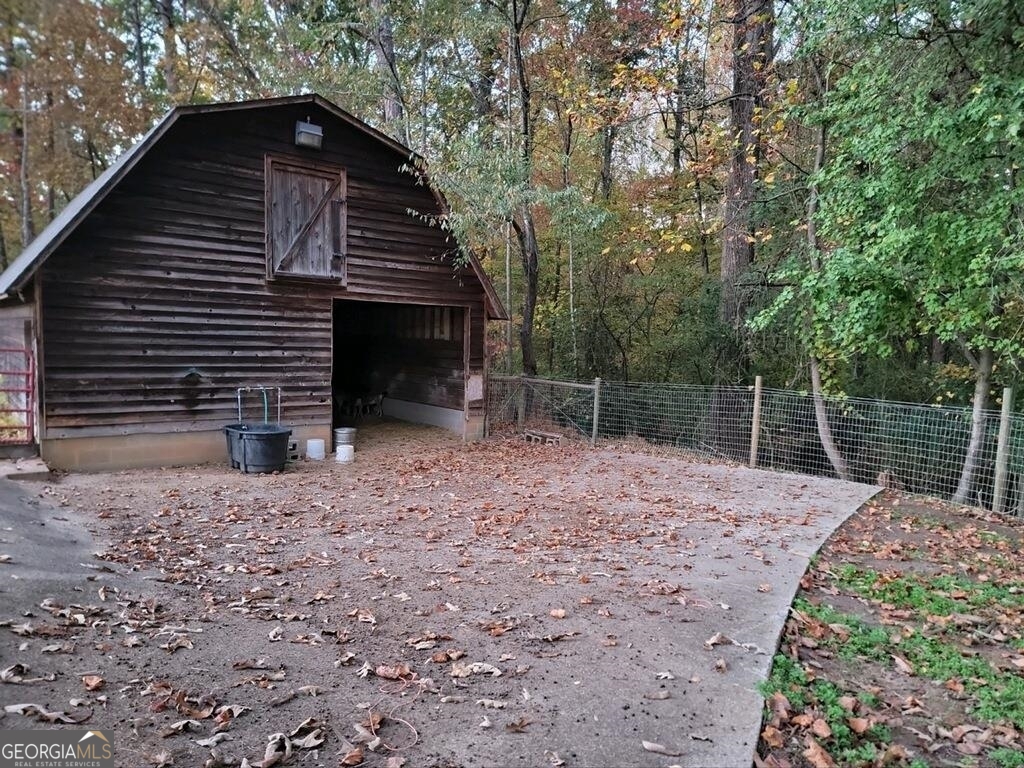 3720 McEver Road Oakwood, GA 30566 - Photo 32 of 73 a backyard of a house with lots of green space