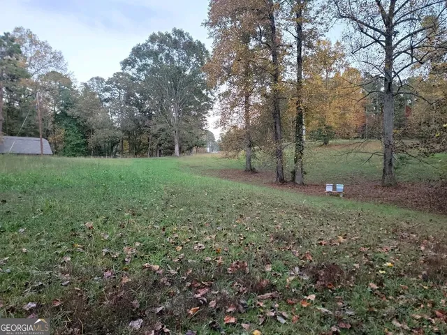 a backyard of a house with lots of green space