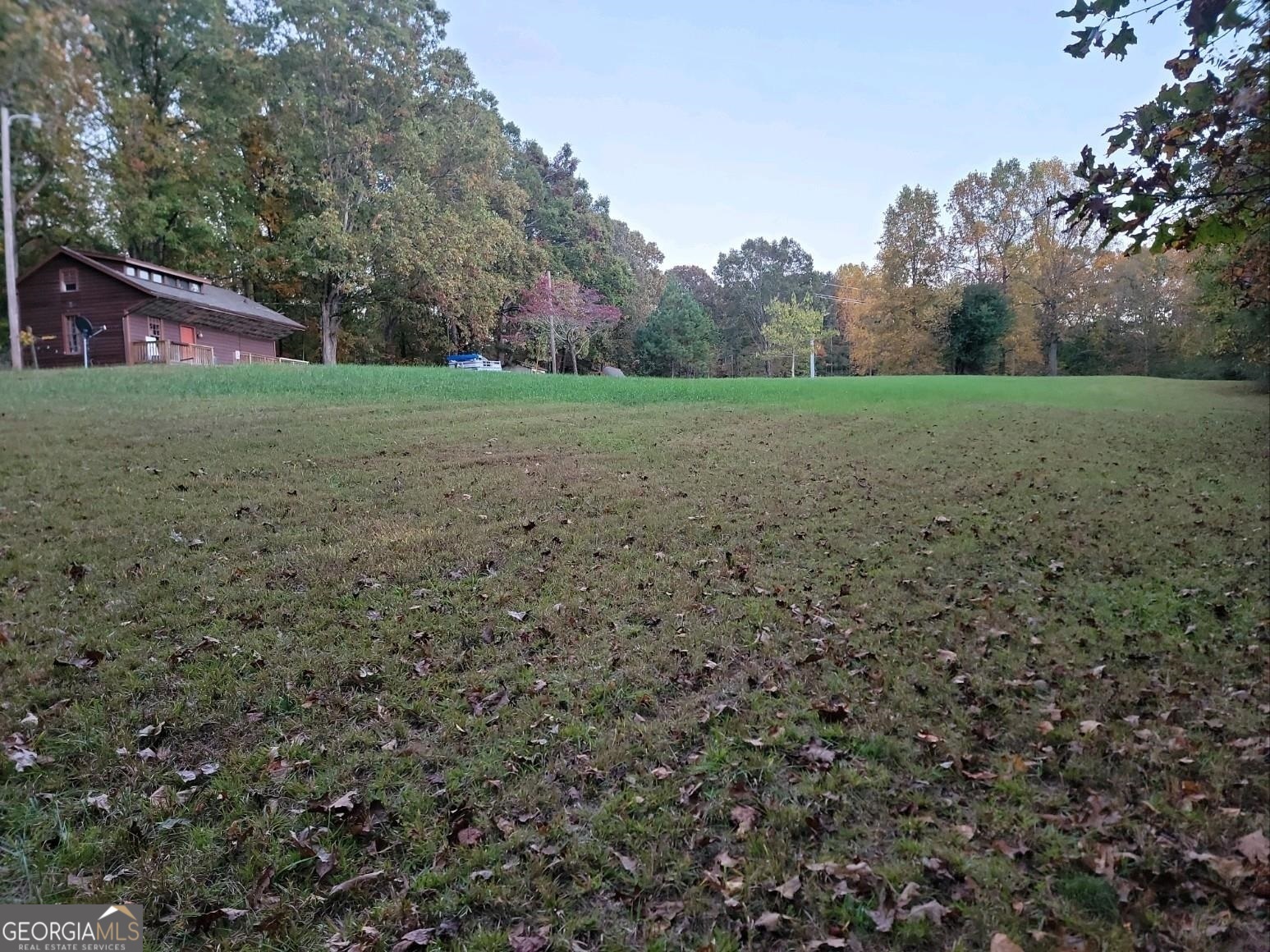 3720 McEver Road Oakwood, GA 30566 - Photo 43 of 73 a view of a field with trees in the background