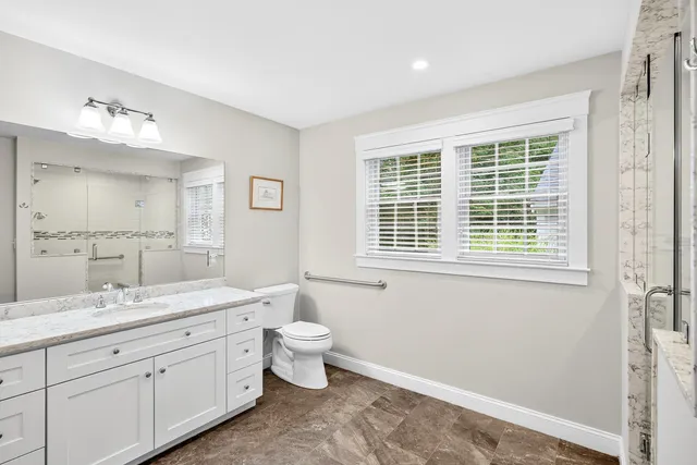 a view of a bedroom with a window and gate