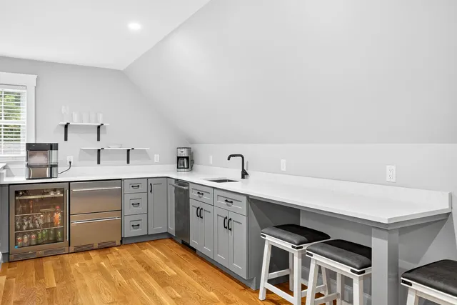 a view of kitchen with furniture and wooden floor