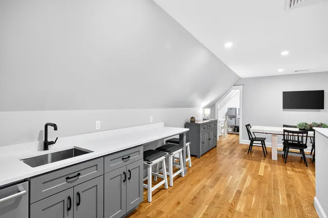 a view of a kitchen with a table and chairs