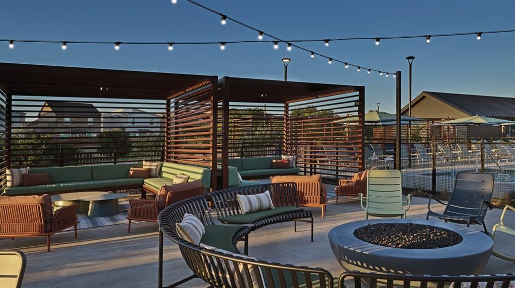 1525 Fm 982, Unit 1107 Princeton, TX 75407 - Photo 19 of 26 a outdoor living space with furniture and a fireplace