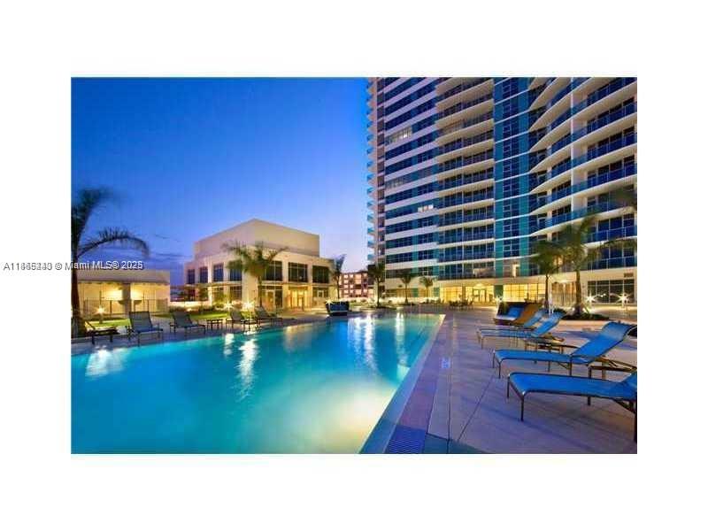3301 Northeast 1st Avenue, Unit H2408 Miami, FL 33137 - Photo 3 of 10 a living room with furniture and garden view