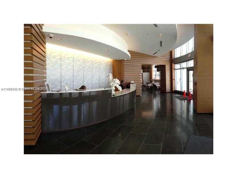 3301 Northeast 1st Avenue, Unit H2408 Miami, FL 33137 - Photo 4 of 10 a black and white photo of a living room
