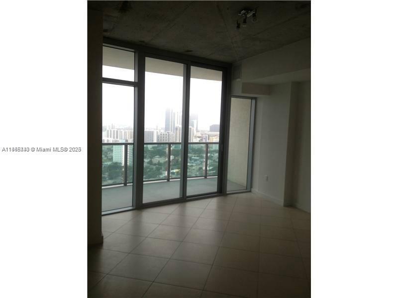 3301 Northeast 1st Avenue, Unit H2408 Miami, FL 33137 - Photo 9 of 10 a view of a room that has a large window