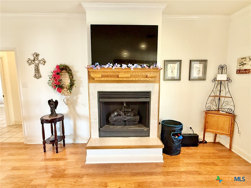 415 South Trinity Street Edna, TX 77957 - Photo 10 of 46 a living room with furniture and a fireplace