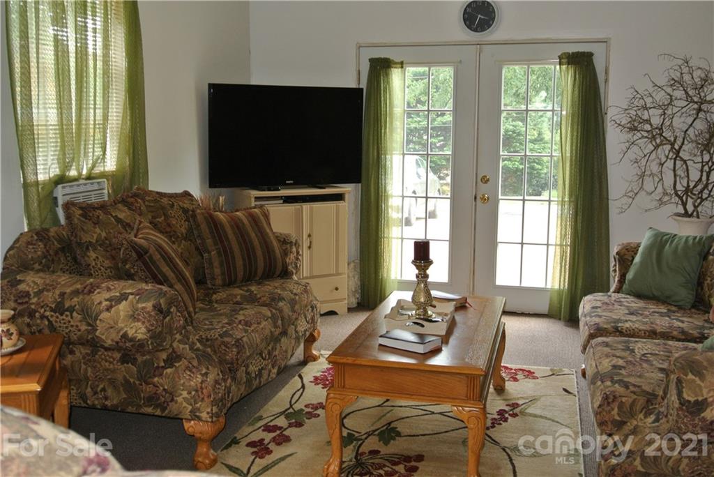 137 Cedar Lane Rutherfordton, NC 28139 - Photo 12 of 26 a living room with furniture and a flat screen tv