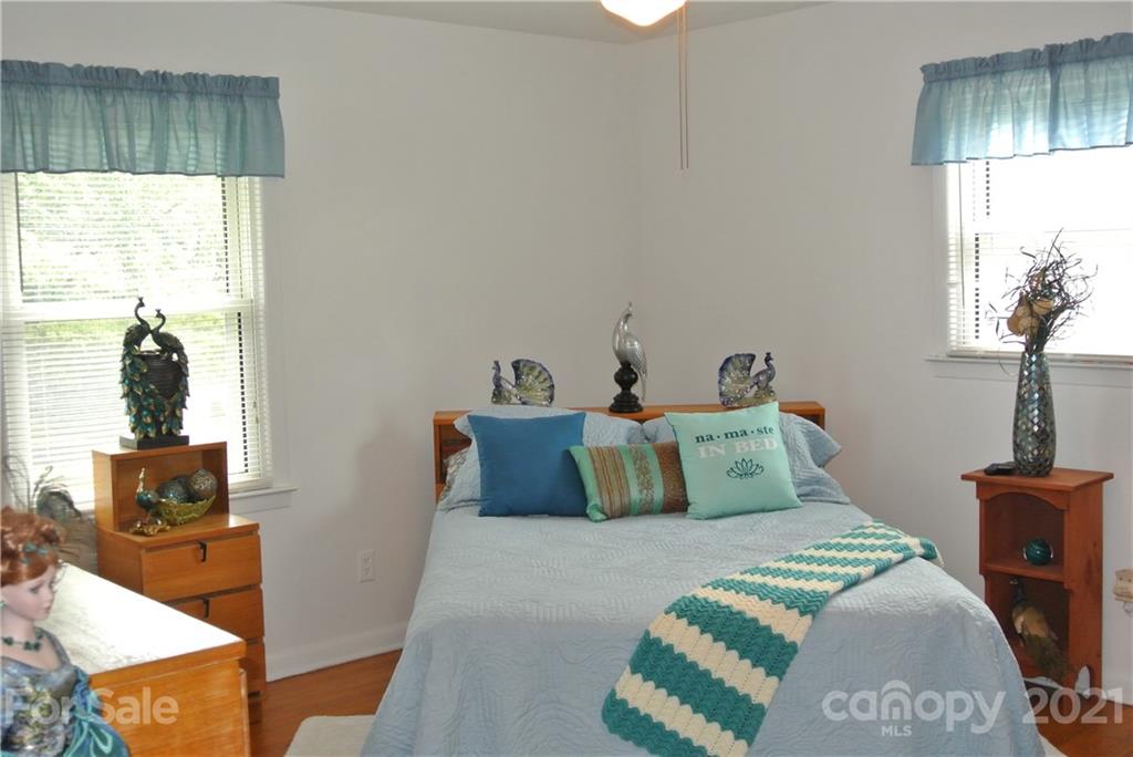 137 Cedar Lane Rutherfordton, NC 28139 - Photo 18 of 26 a bedroom with a bed and wooden floor