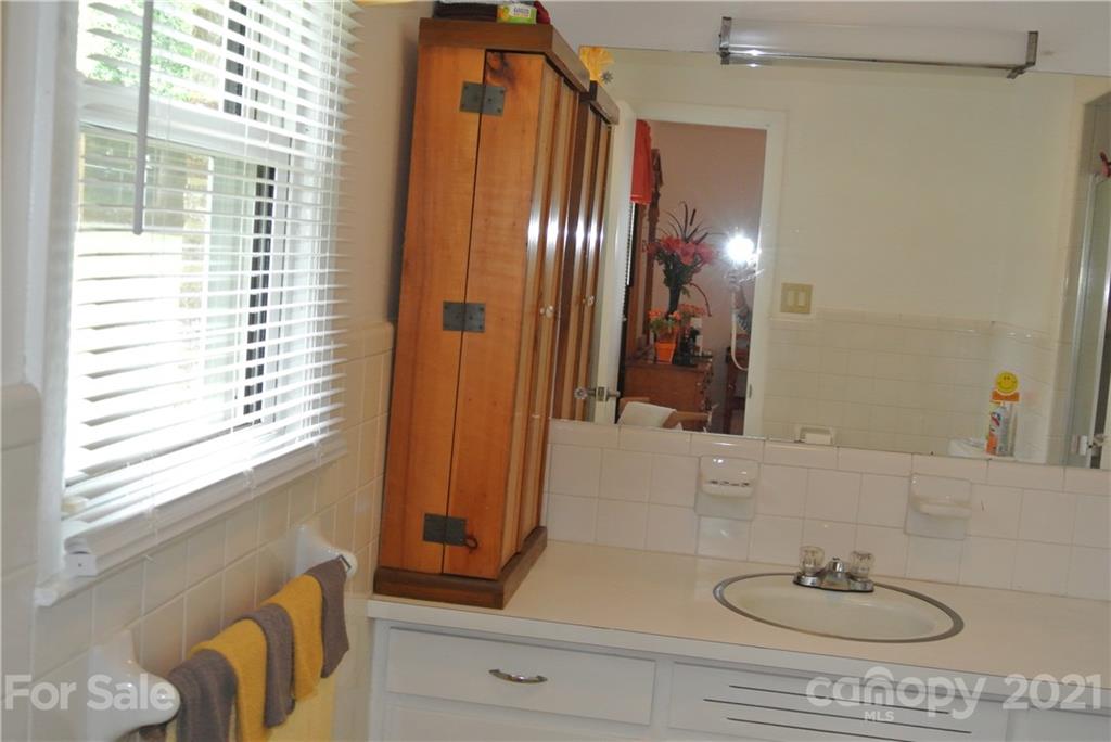 137 Cedar Lane Rutherfordton, NC 28139 - Photo 19 of 26 a bathroom with a sink and a mirror