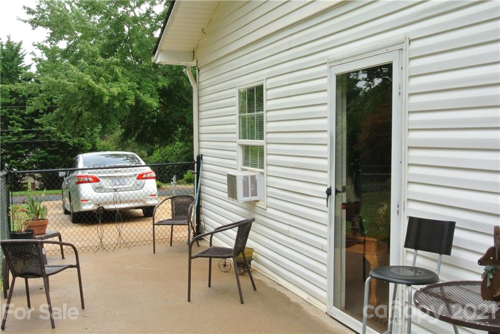 137 Cedar Lane Rutherfordton, NC 28139 - Photo 23 of 26 a view of a patio with table and chairs and potted plants