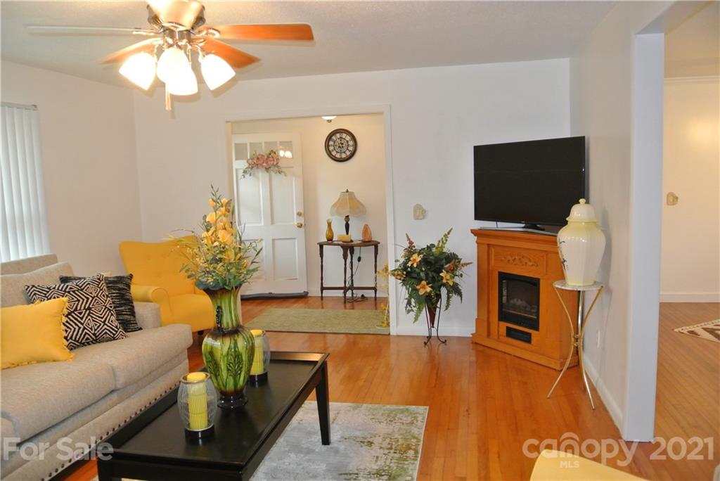 137 Cedar Lane Rutherfordton, NC 28139 - Photo 4 of 26 a living room with furniture and a flat screen tv