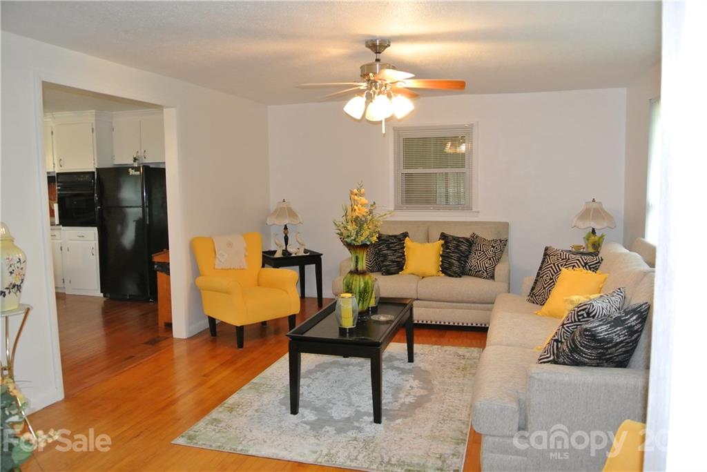 137 Cedar Lane Rutherfordton, NC 28139 - Photo 6 of 26 a living room with furniture and a chandelier
