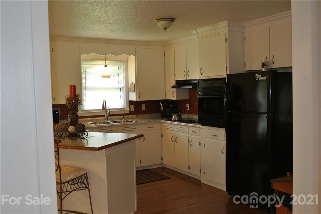 137 Cedar Lane Rutherfordton, NC 28139 - Photo 8 of 26 a kitchen with a sink and cabinets